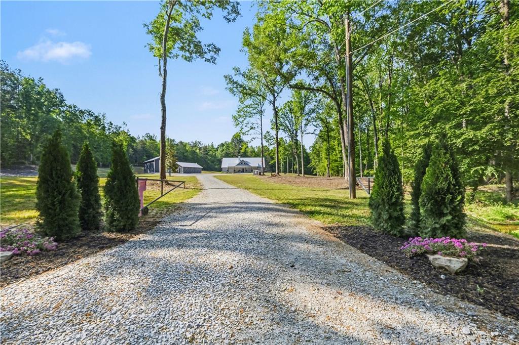 1596 Kirk-Langford Road Danielsville, GA 30633 - Photo 3 of 37 a view of a park with swings