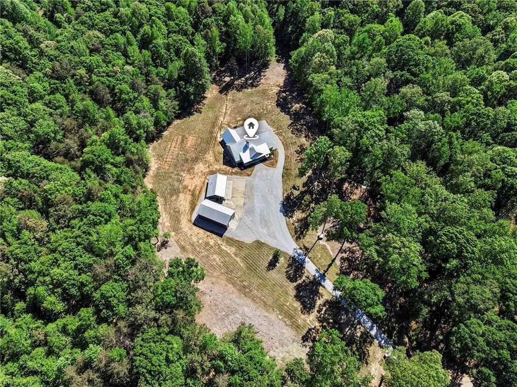 1596 Kirk-Langford Road Danielsville, GA 30633 - Photo 33 of 37 an aerial view of a house with a yard and large trees