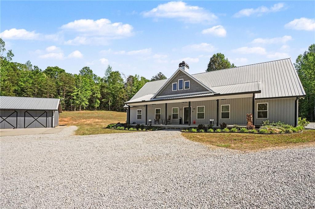1596 Kirk-Langford Road Danielsville, GA 30633 - Photo 37 of 37 a front view of a house with a garden