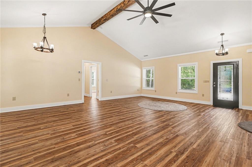 1596 Kirk-Langford Road Danielsville, GA 30633 - Photo 7 of 37 a view of empty room with wooden floor and fan