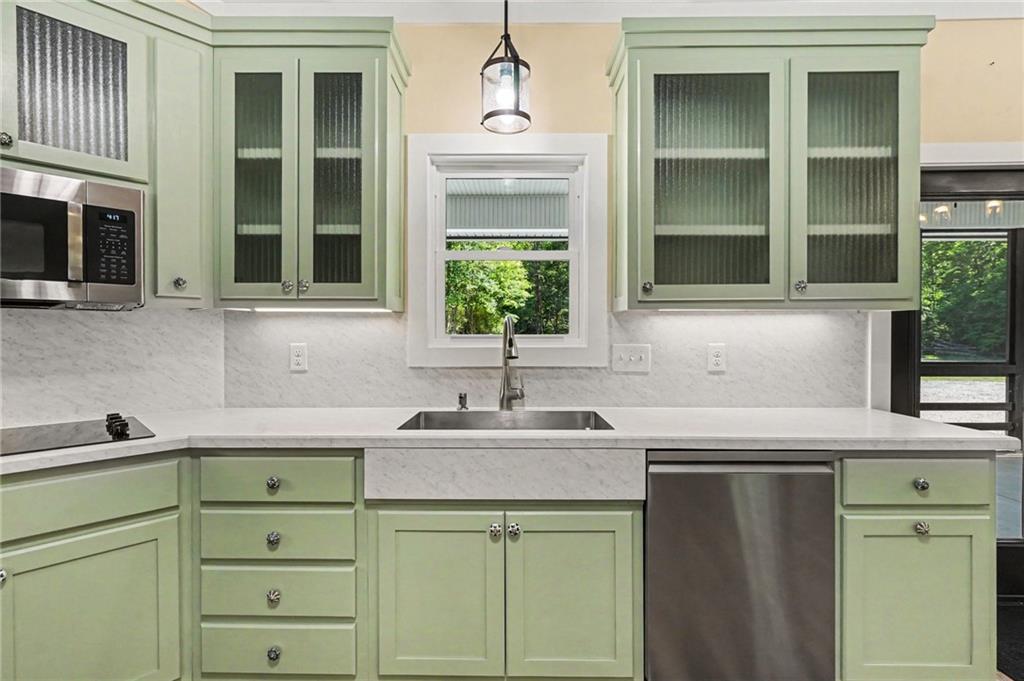 1596 Kirk-Langford Road Danielsville, GA 30633 - Photo 10 of 37 a kitchen with a sink and cabinets