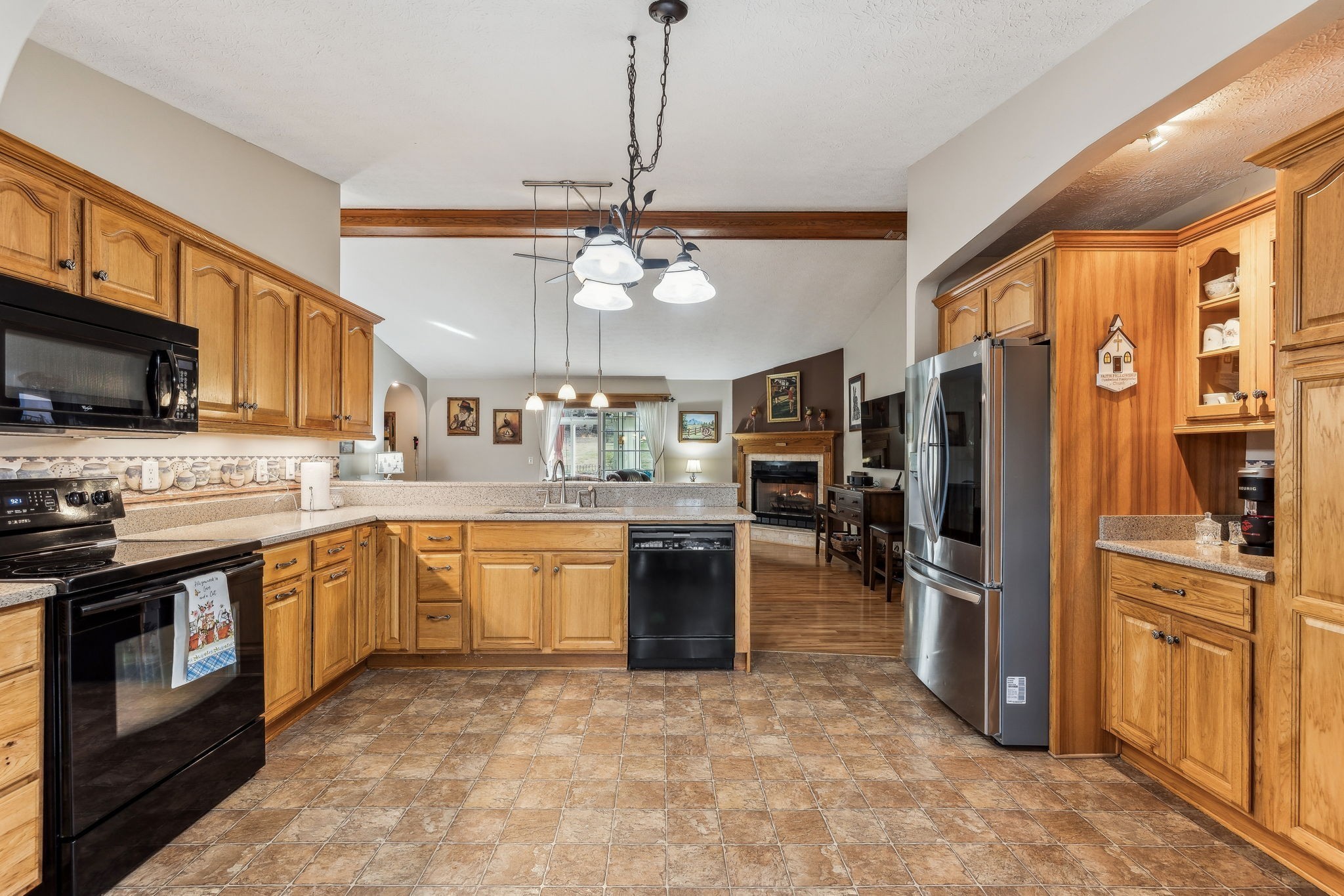 2079 Rock Springs Road Columbia, TN 38401 - Photo 17 of 83 a kitchen with stainless steel appliances granite countertop a refrigerator a stove a sink a oven with a dining table and chairs