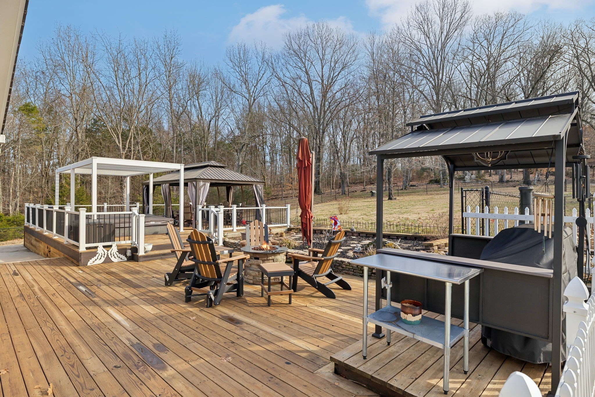 2079 Rock Springs Road Columbia, TN 38401 - Photo 47 of 83 a view of a patio with table and chairs and wooden floor
