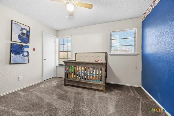 a bed room with furniture and a window