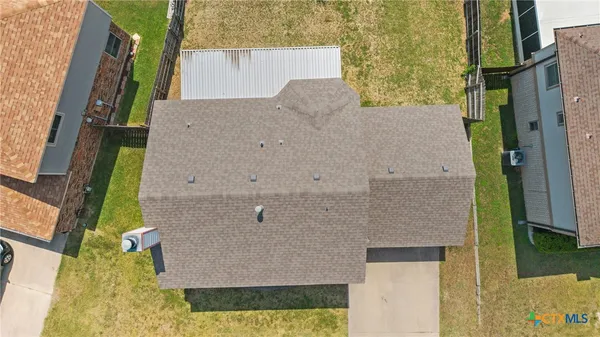 aerial view of a house with a yard