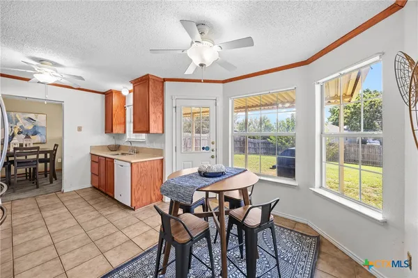 a view of a dining room with furniture window and outside view