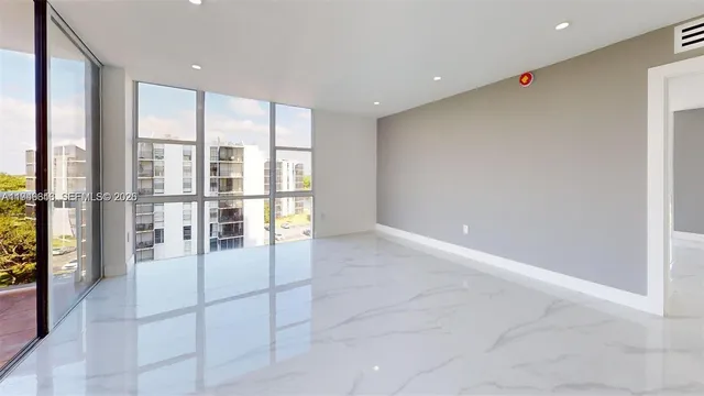 a view of an empty room with a window