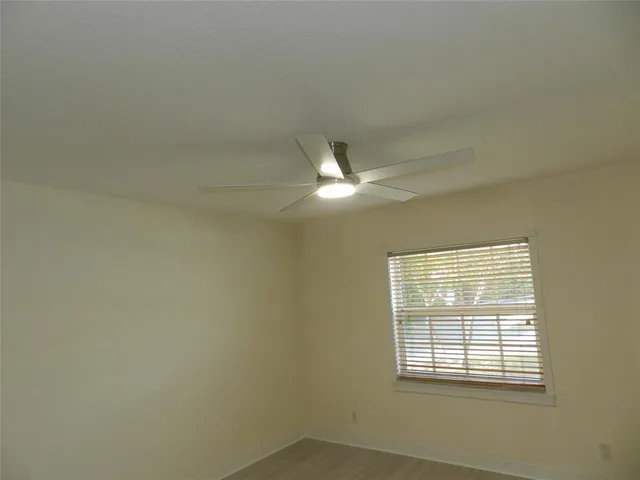 a white toilet sitting next to a shower