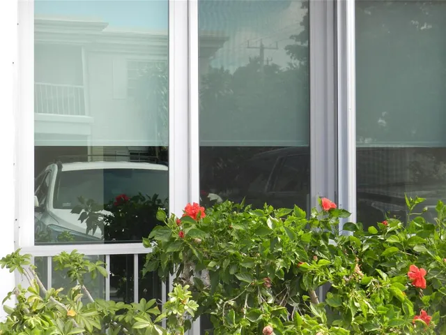a bathroom with a sink and glass door