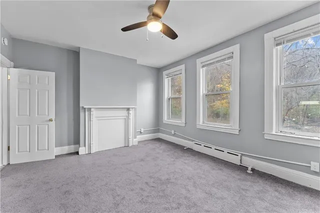 a view of an empty room with a window