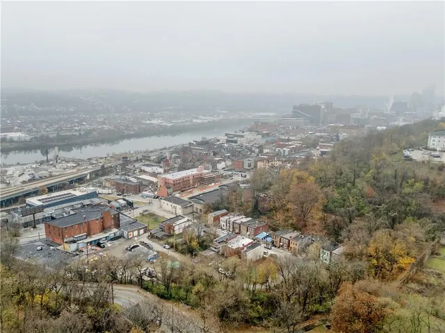 an aerial view of residential house and space