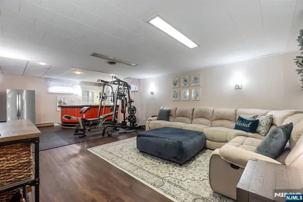 a living room with furniture and a chandelier