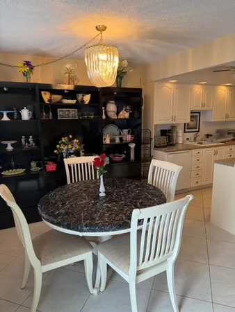 a table room with dining table and chairs