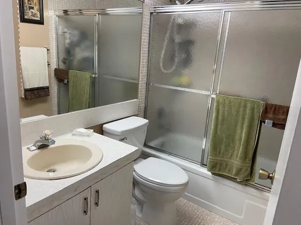 a bathroom with a sink and mirror