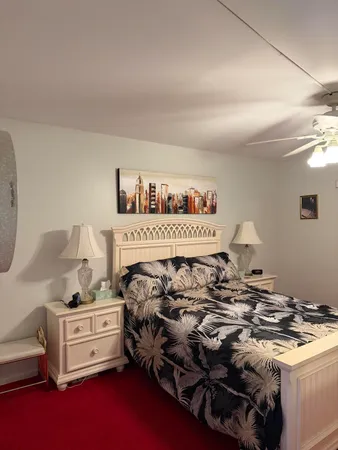 a bed room with a bed and a window