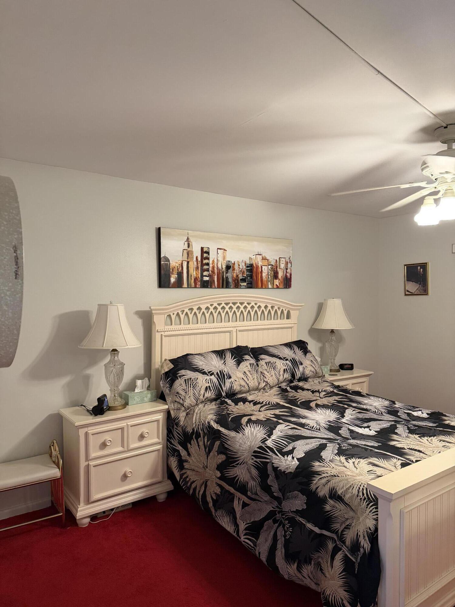 4042 Exeter C Boca Raton, FL 33434 - Photo 10 of 13 a bed room with a bed and a window