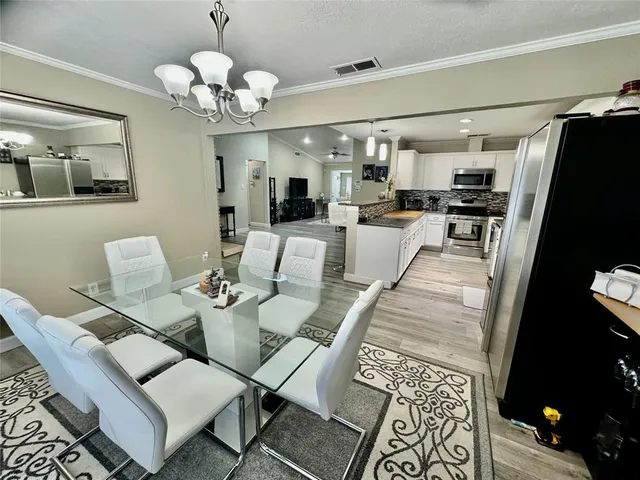 a view of a dining room with furniture