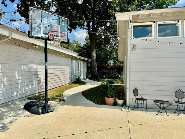a view of a chairs and table in the patio