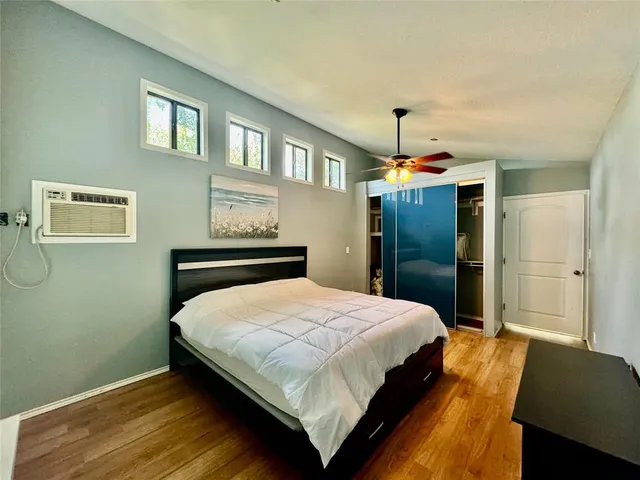 a bedroom with a bed and a dresser