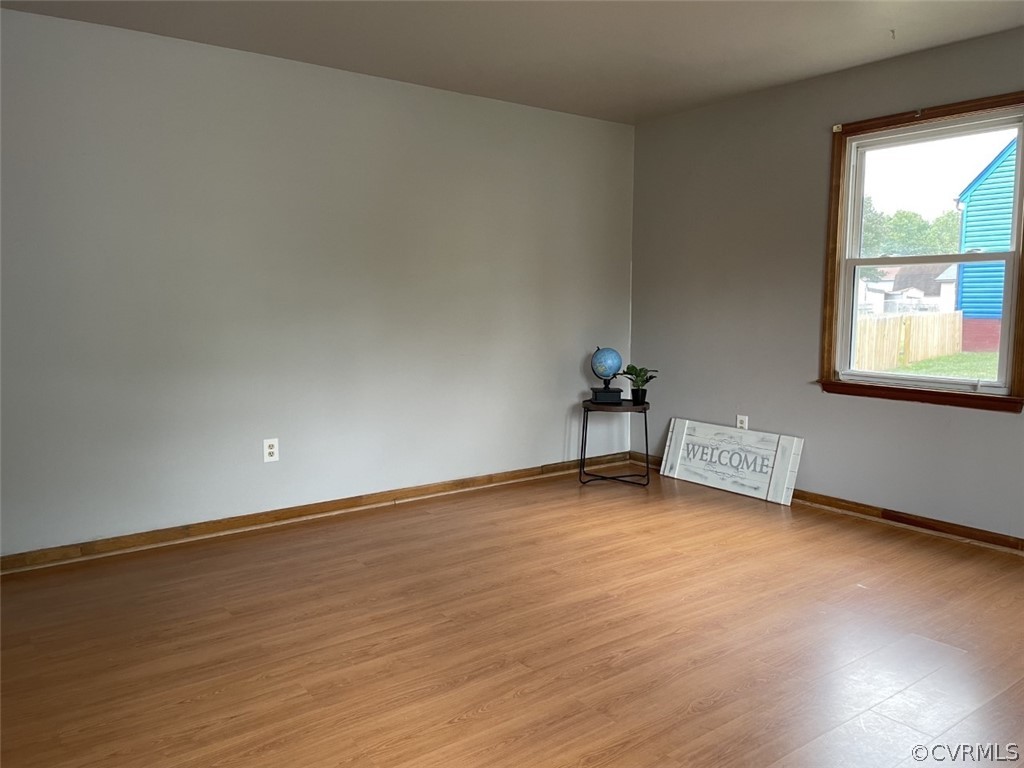 3113 Fielding Road Colonial Heights, VA 23834 - Photo 3 of 24 a view of an empty room with wooden floor and a window
