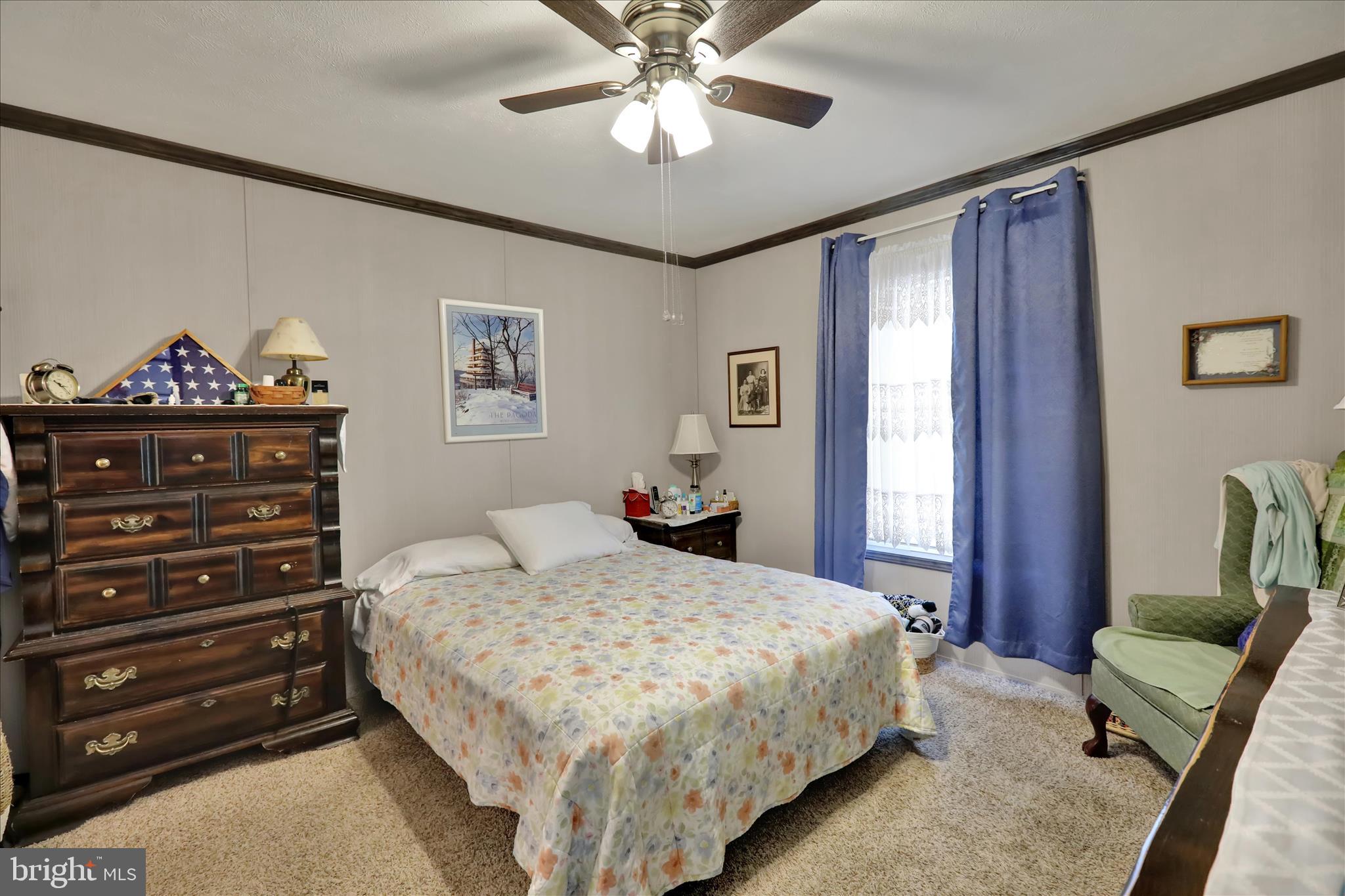 38 Keystone Road Reading, PA 19606 - Photo 17 of 22 a bedroom with a bed and a chandelier