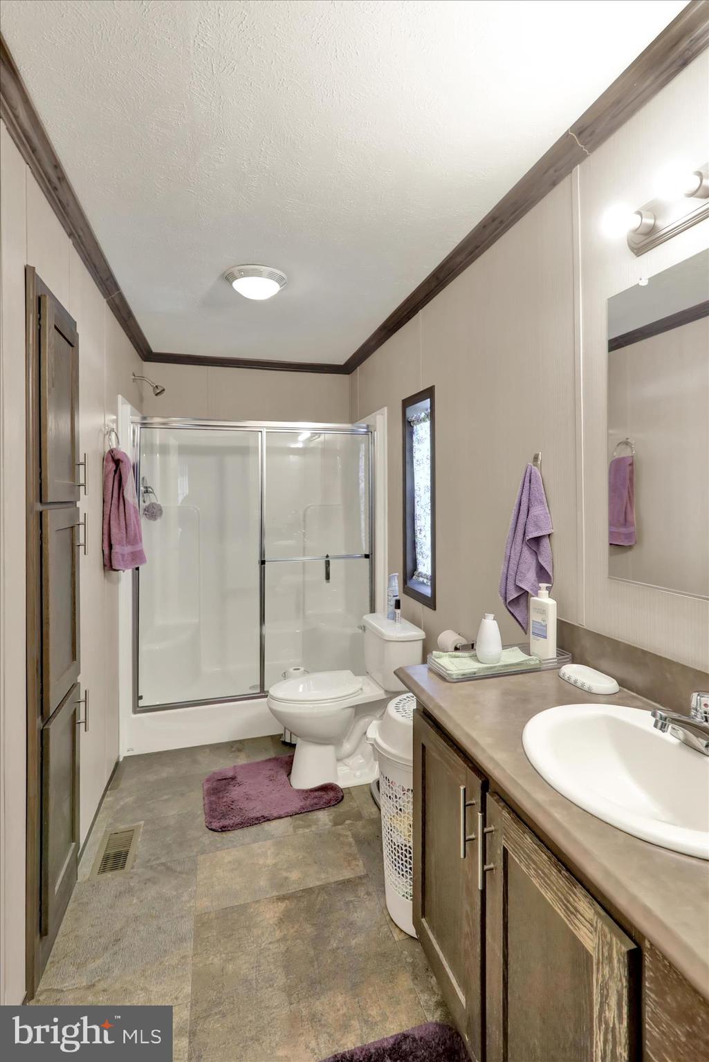 38 Keystone Road Reading, PA 19606 - Photo 20 of 22 a spacious bathroom with a granite countertop sink a toilet a mirror and shower
