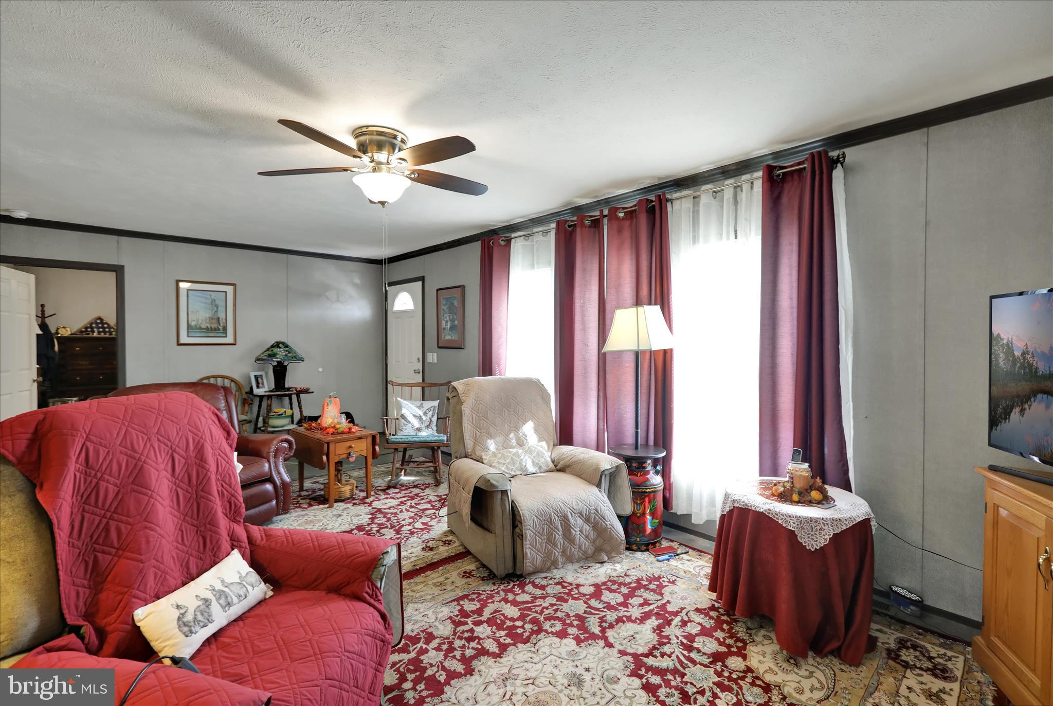 38 Keystone Road Reading, PA 19606 - Photo 10 of 22 a living room with furniture ceiling fan and a window