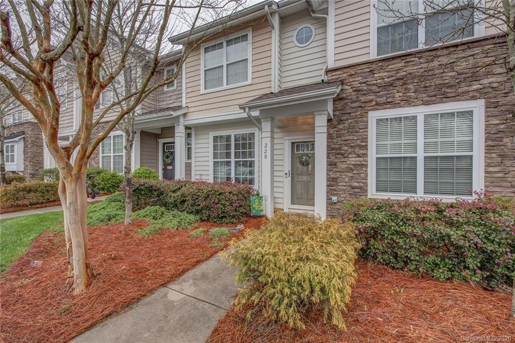 220 Falling Ridge, Unit 149 Mount Holly, NC 28012 - Photo 1 of 19 front view of a brick house with a yard