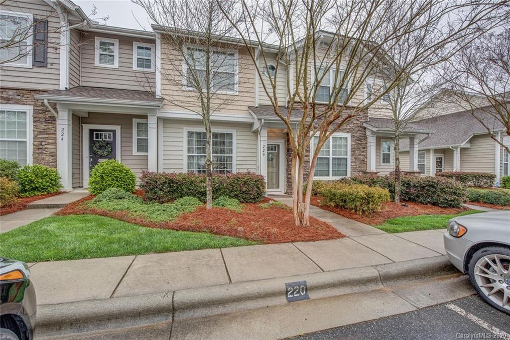220 Falling Ridge, Unit 149 Mount Holly, NC 28012 - Photo 2 of 19 a view of a house with a garden and pathway