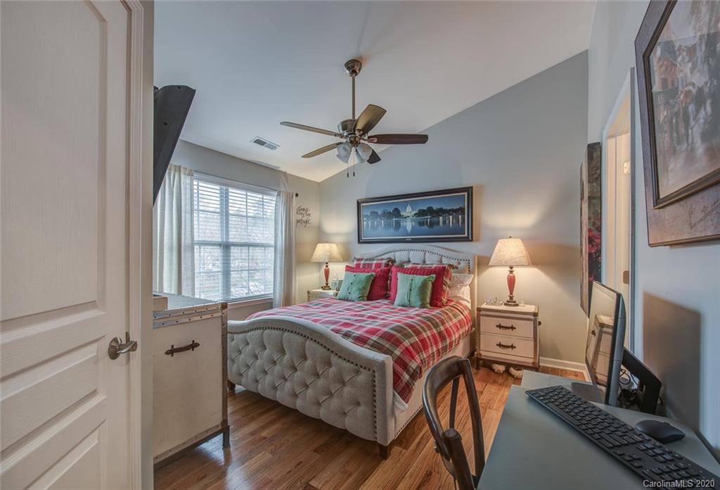 220 Falling Ridge, Unit 149 Mount Holly, NC 28012 - Photo 11 of 19 a bedroom with a bed and a flat screen tv