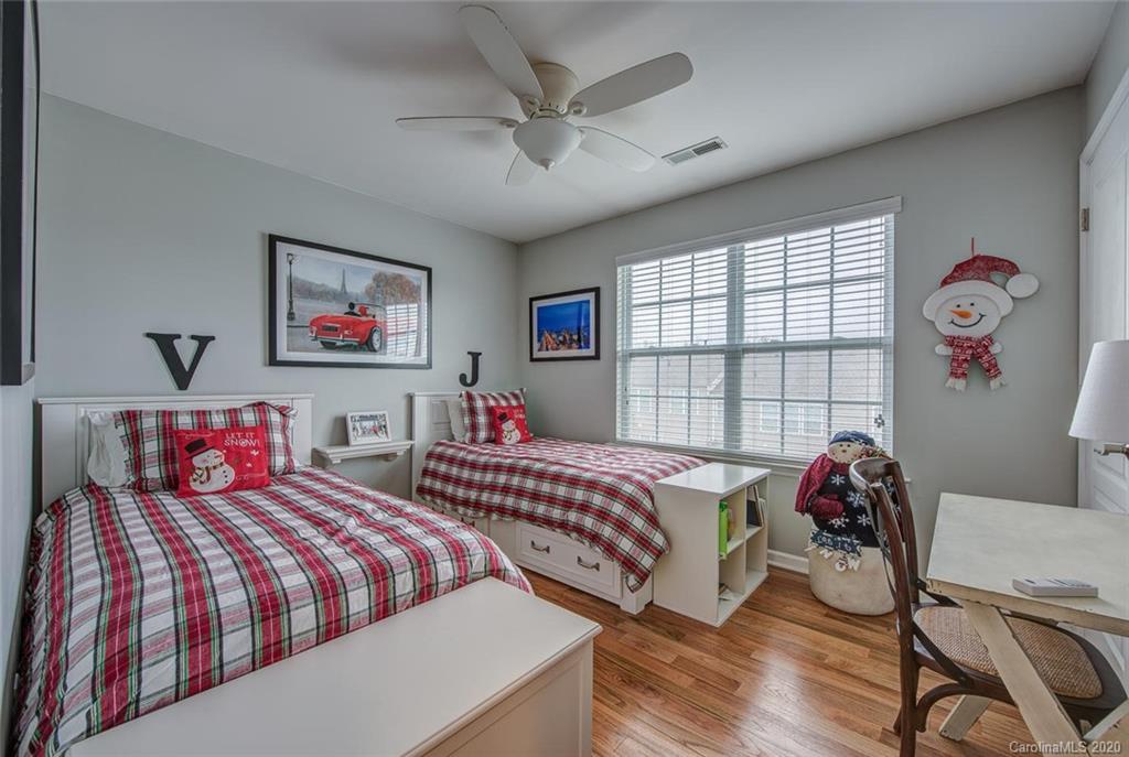 220 Falling Ridge, Unit 149 Mount Holly, NC 28012 - Photo 15 of 19 a bedroom with two bed and a window