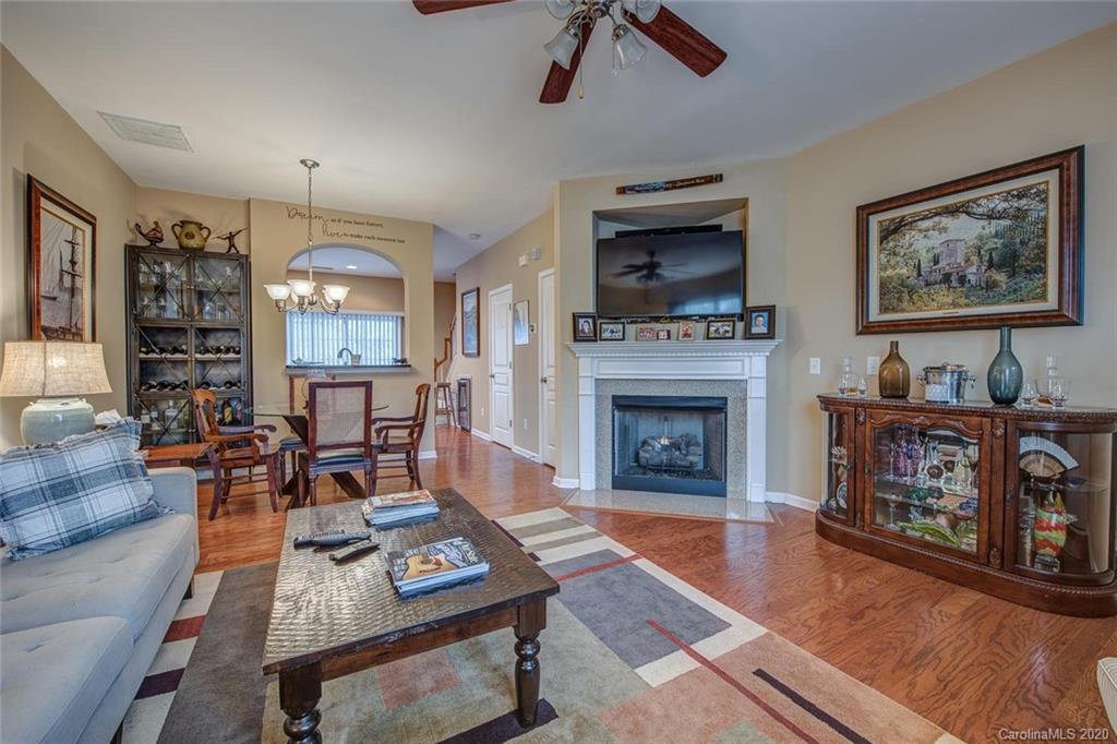 220 Falling Ridge, Unit 149 Mount Holly, NC 28012 - Photo 4 of 19 a living room with furniture and a fireplace
