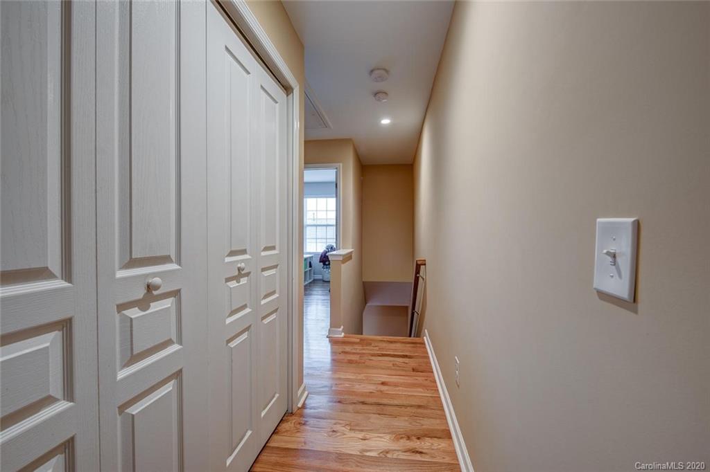 220 Falling Ridge, Unit 149 Mount Holly, NC 28012 - Photo 10 of 19 a view of a hallway with a chandelier