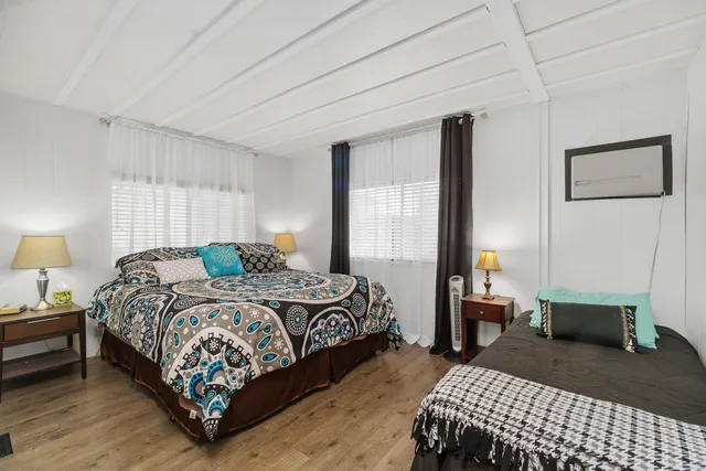 a living room with furniture and a lamp