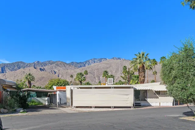 a view of a street with a building in the background