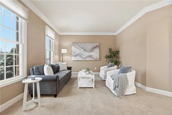 a living room with furniture and a large window