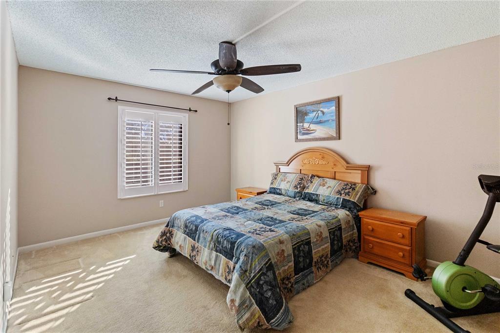 8205 Sun Spring Circle, Unit C2 Orlando, FL 32825 - Photo 11 of 18 a bedroom with a bed and a window