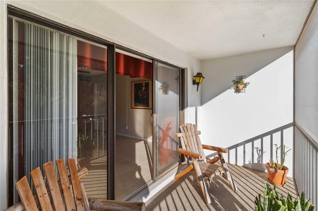 8205 Sun Spring Circle, Unit C2 Orlando, FL 32825 - Photo 17 of 18 a view of staircase with lots of frames on wall and wooden floor
