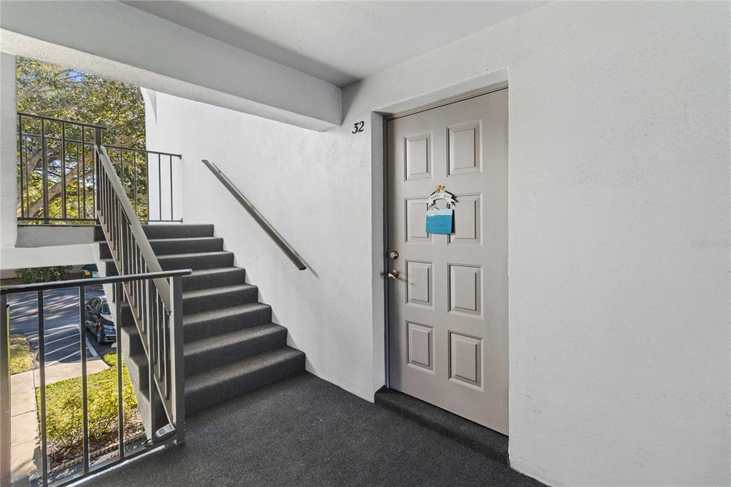 8205 Sun Spring Circle, Unit C2 Orlando, FL 32825 - Photo 3 of 18 a view of an entryway with wooden floor and windows