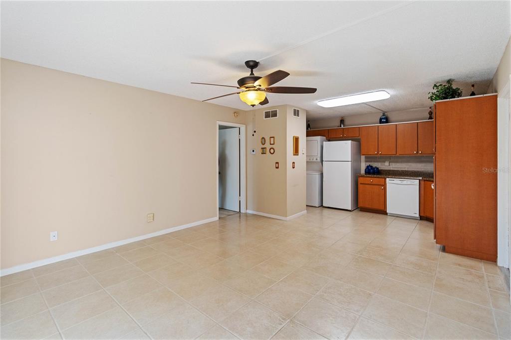 8205 Sun Spring Circle, Unit C2 Orlando, FL 32825 - Photo 6 of 18 a view of a kitchen with a sink and refrigerator