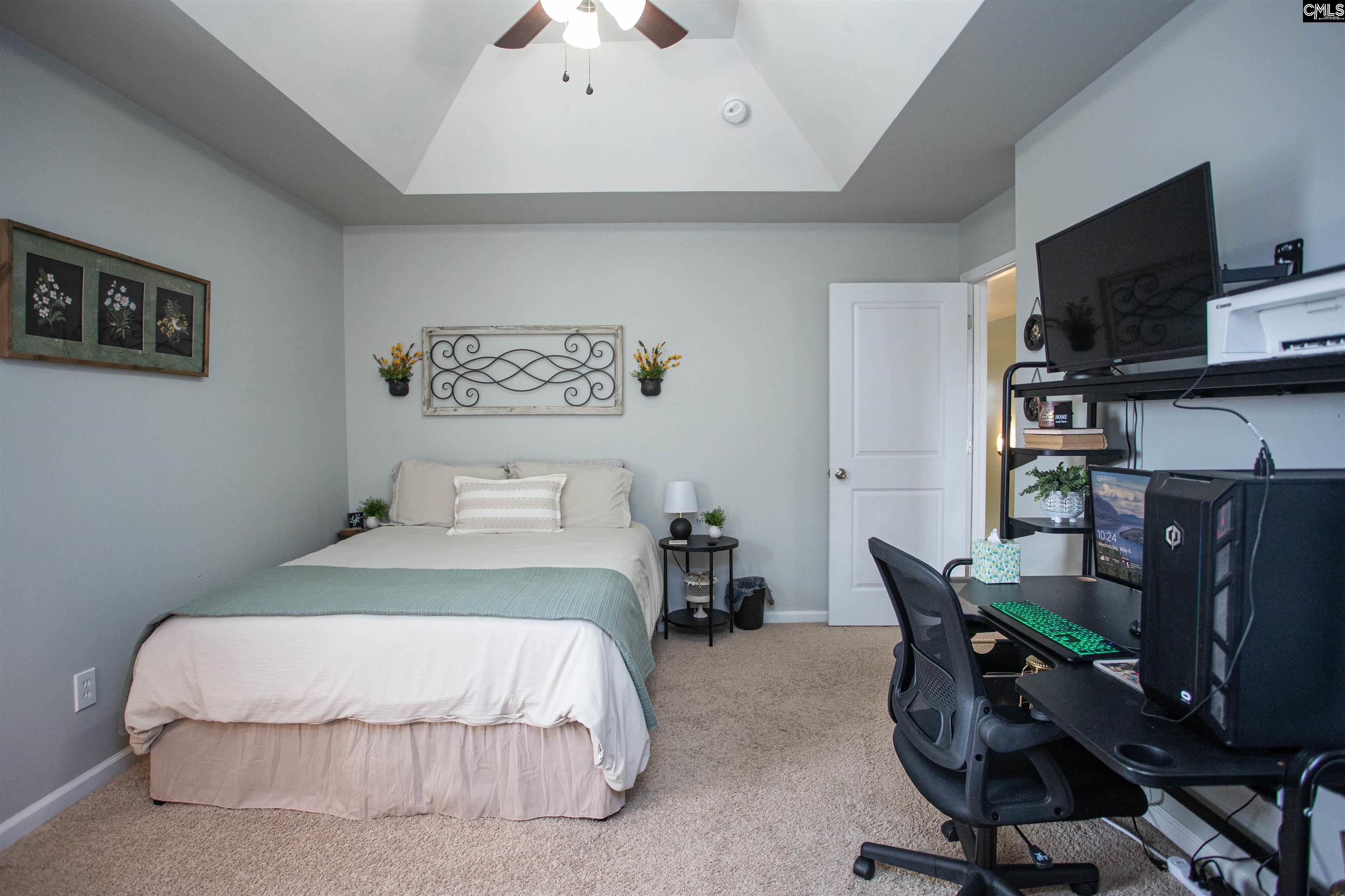 7 Templand Court Elgin, SC 29045 - Photo 36 of 47 a bedroom with a bed a desk and chair