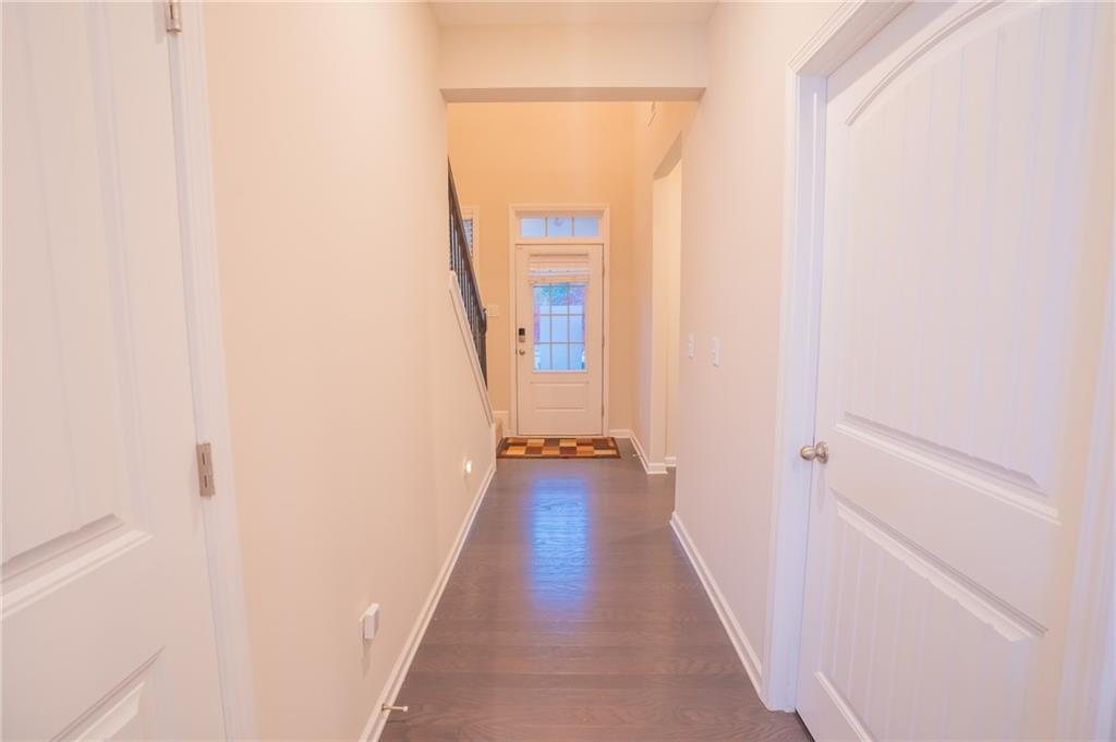 2420 Boxwalking Court Cumming, GA 30040 - Photo 16 of 42 a view of a hallway with wooden floor