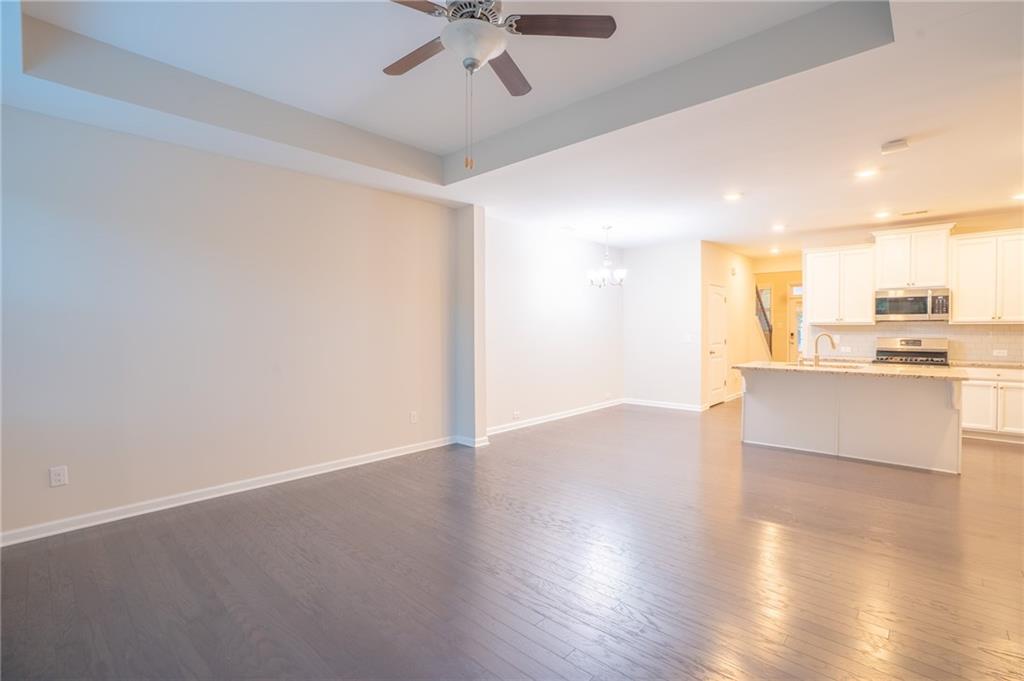2420 Boxwalking Court Cumming, GA 30040 - Photo 6 of 42 a view of a kitchen with a sink and a window
