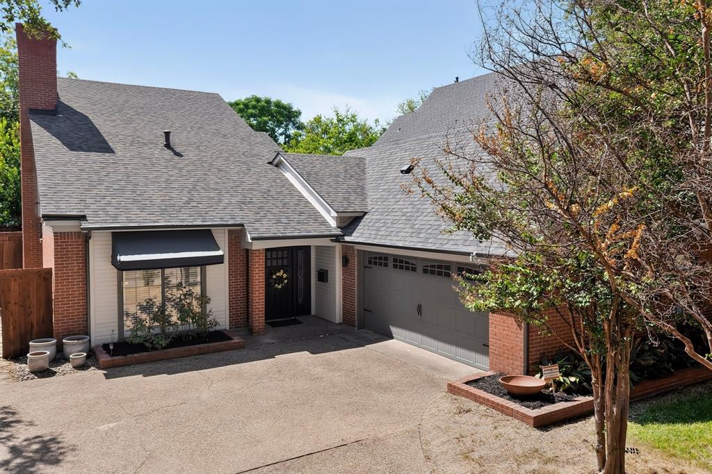 1526 Abrams Road Dallas, TX 75214 - Photo 2 of 38 Brick exterior with a dark asphalt shingle roof