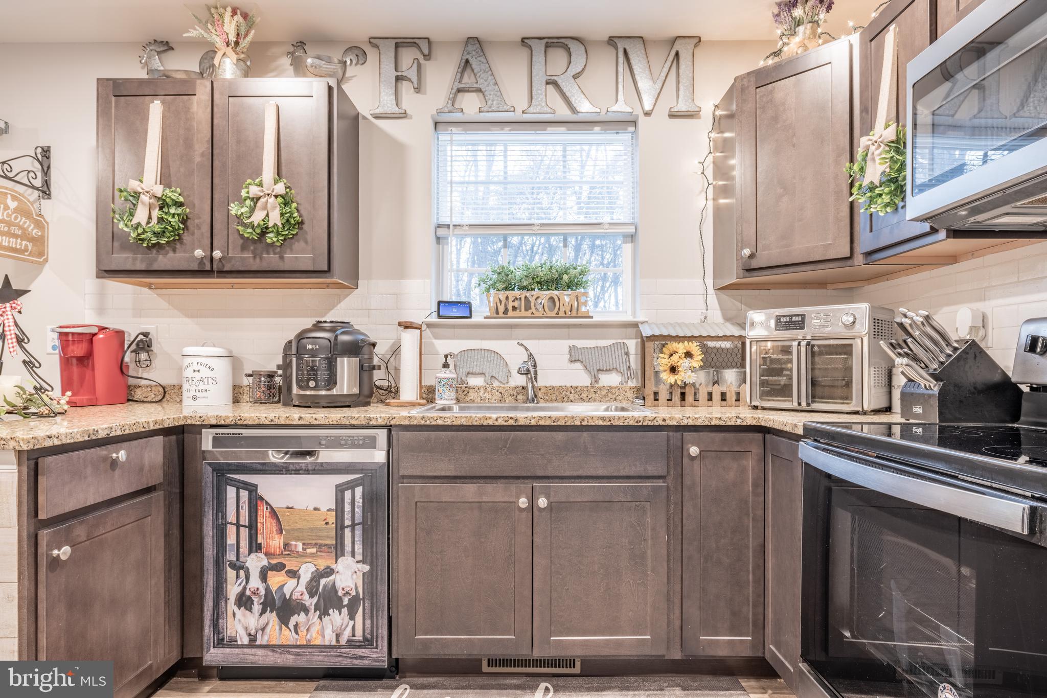 111 Cee Jay Road Chestertown, MD 21620 - Photo 14 of 38 a kitchen with stainless steel appliances a sink stove and cabinets