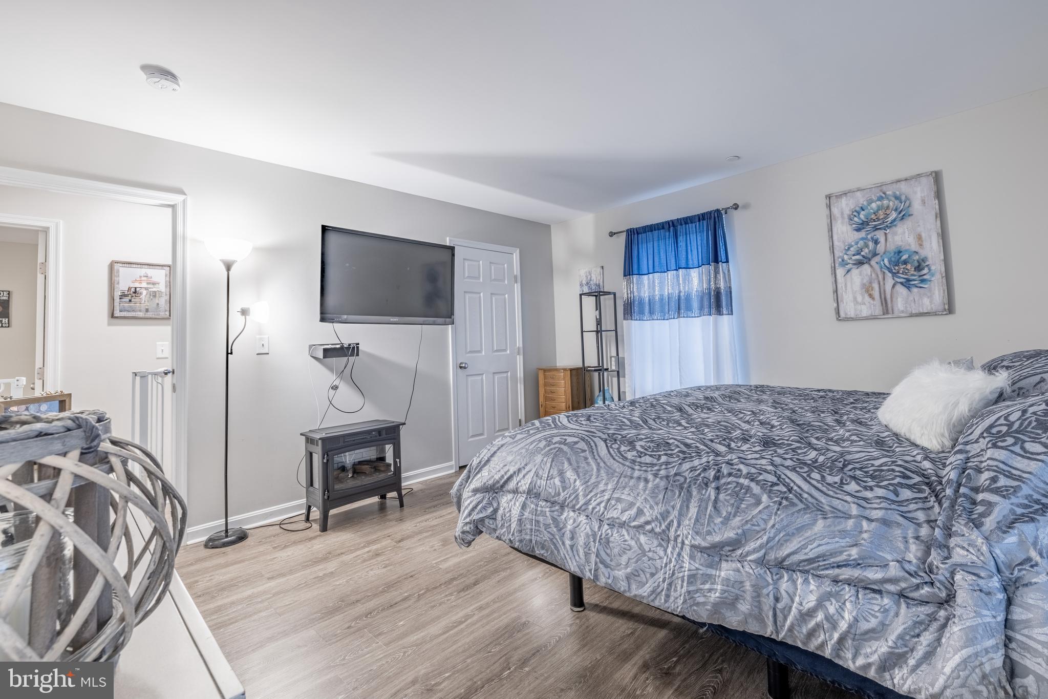 111 Cee Jay Road Chestertown, MD 21620 - Photo 18 of 38 a bedroom with a bed and a flat screen tv