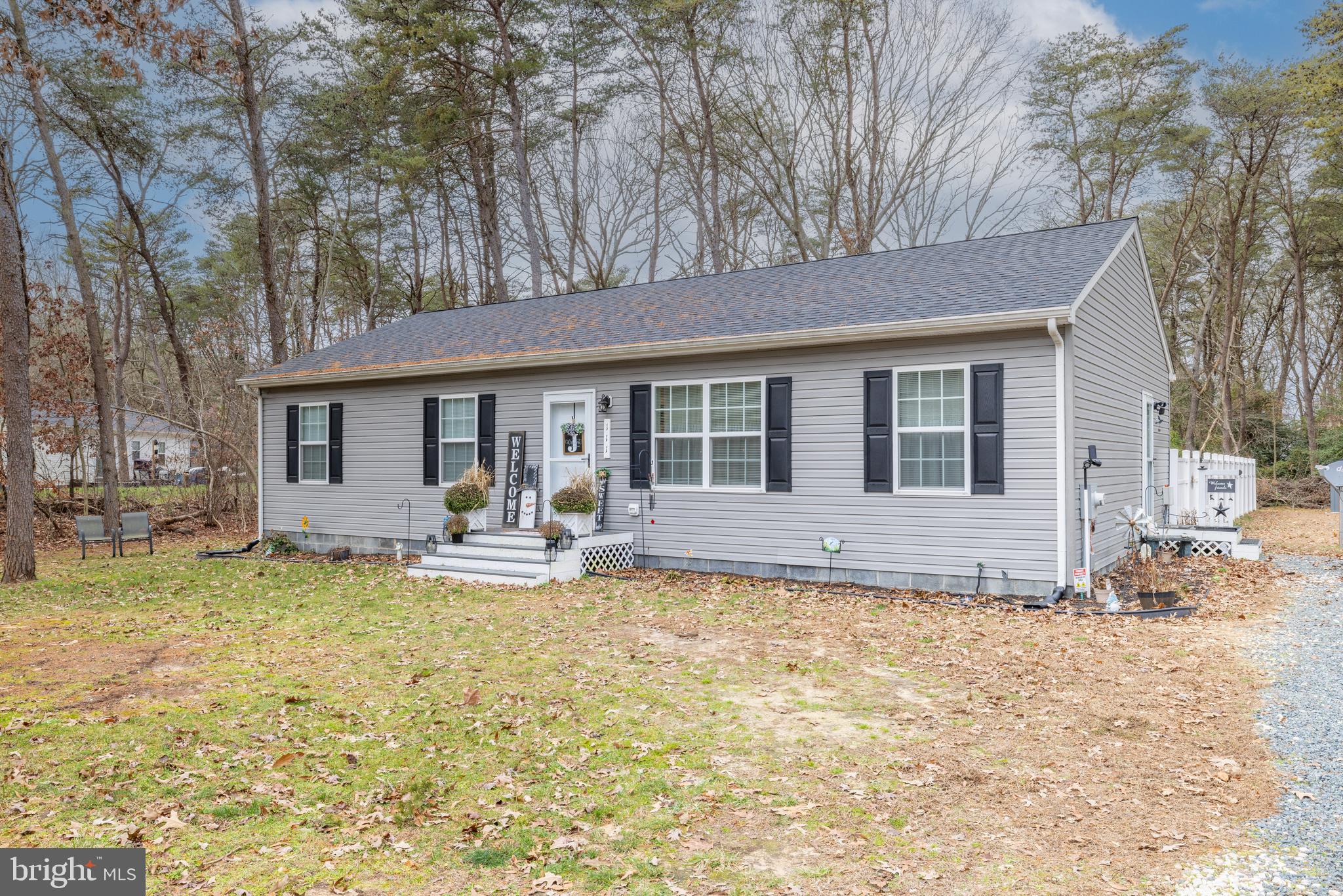 111 Cee Jay Road Chestertown, MD 21620 - Photo 2 of 38 a front view of a house with swimming pool and porch