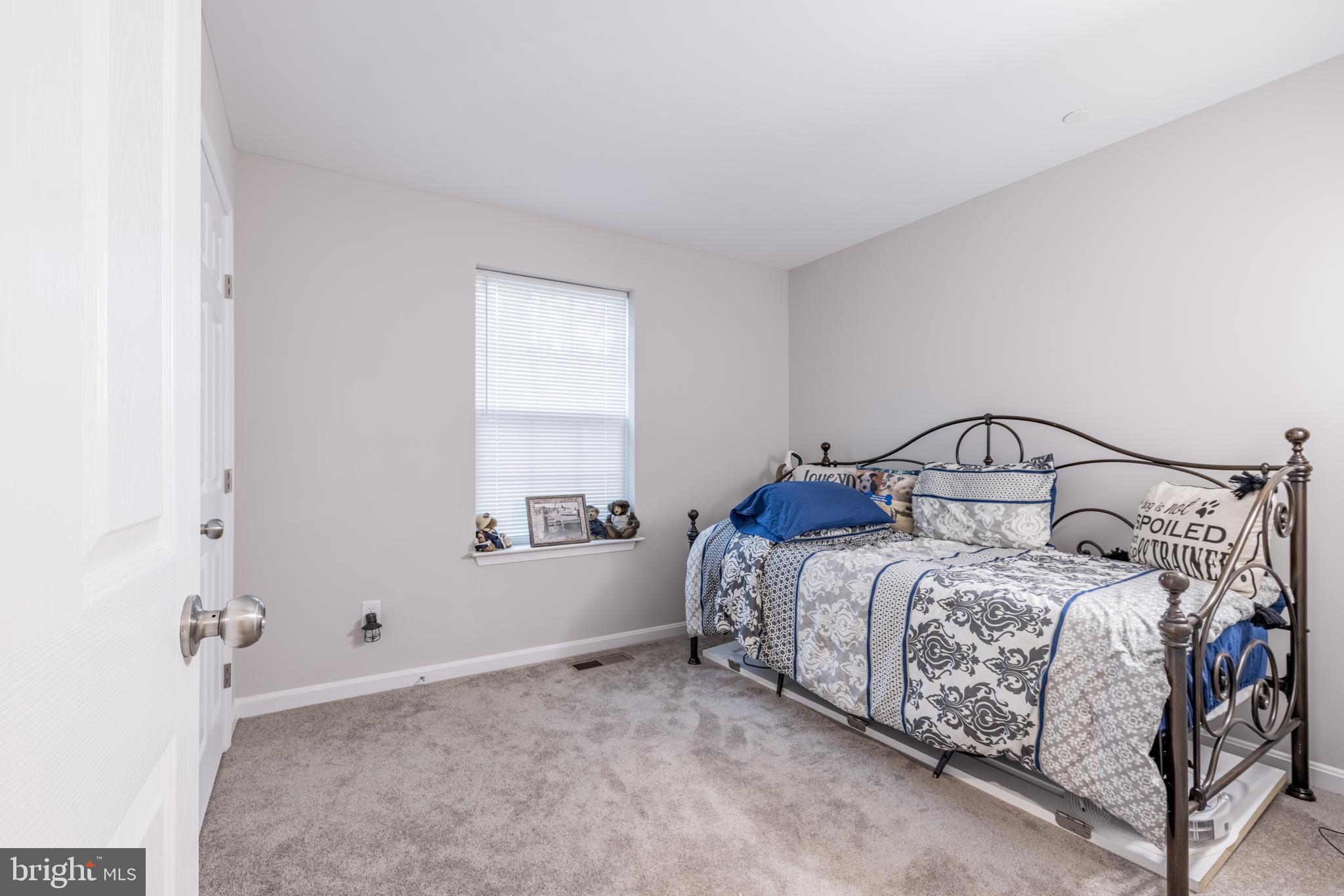 111 Cee Jay Road Chestertown, MD 21620 - Photo 29 of 38 a bedroom with a bed and a window