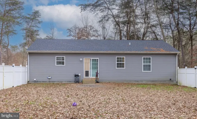 a house with trees in front of it