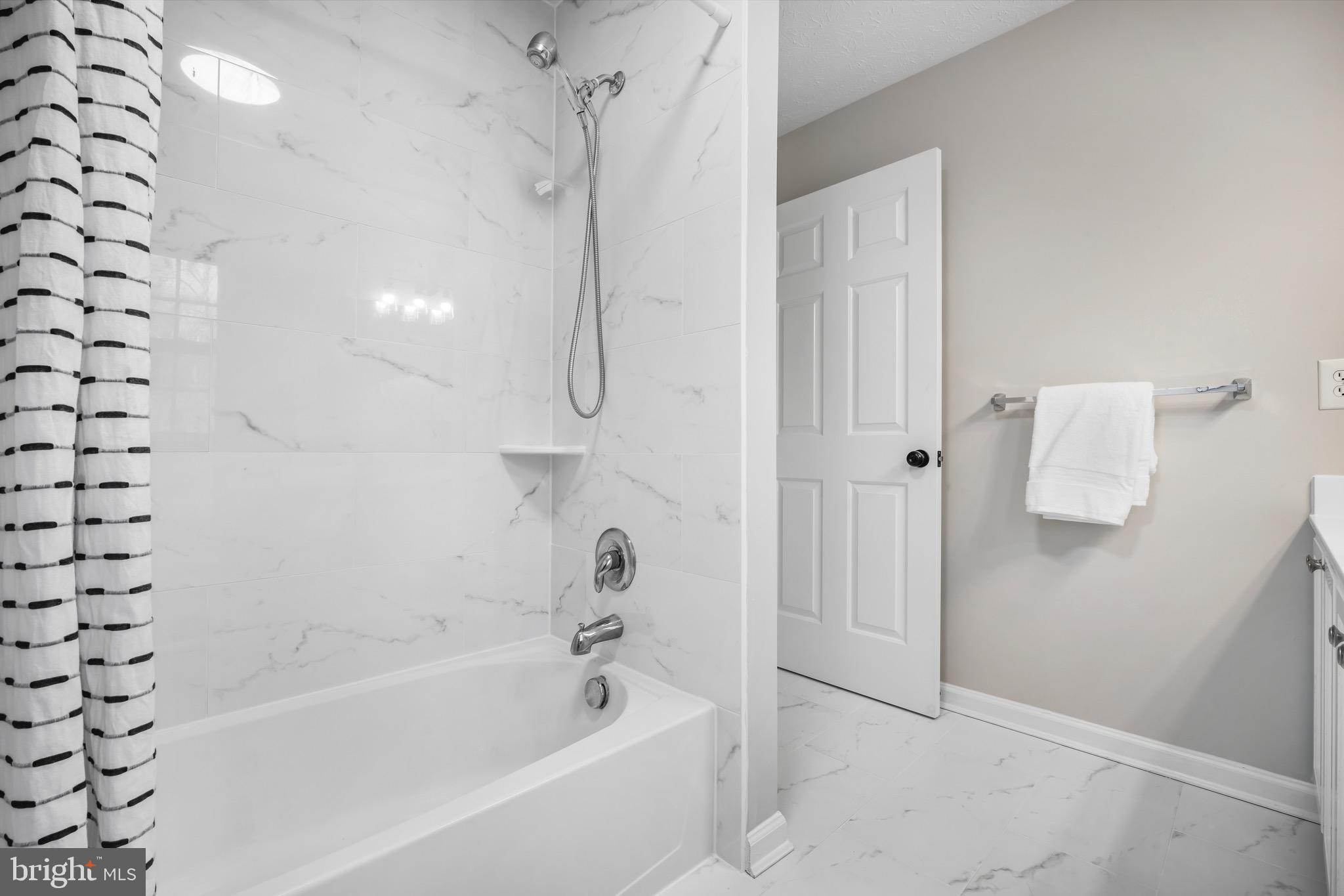 7739 Rotherham Drive Hanover, MD 21076 - Photo 21 of 39 Owner's En-Suite Bathroom | New Tiles & Tub Shower